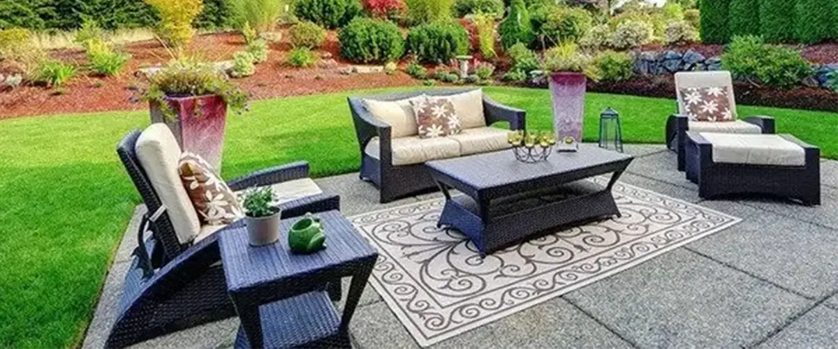Outdoor living space with concrete patio and furniture
