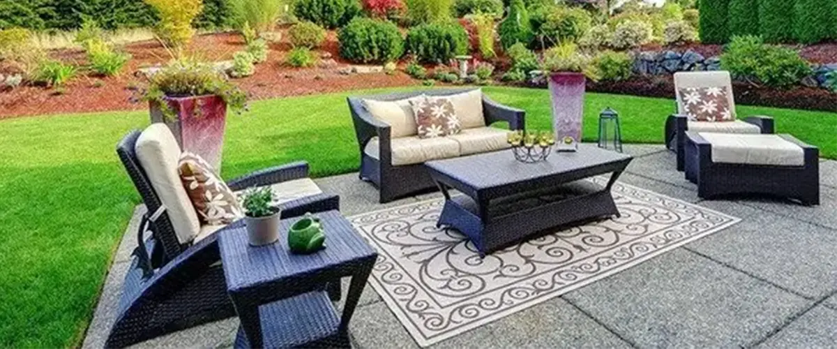 https://farrellslandscaping.com/wp-content/uploads/2021/09/Outdoor-living-space-with-concrete.webp