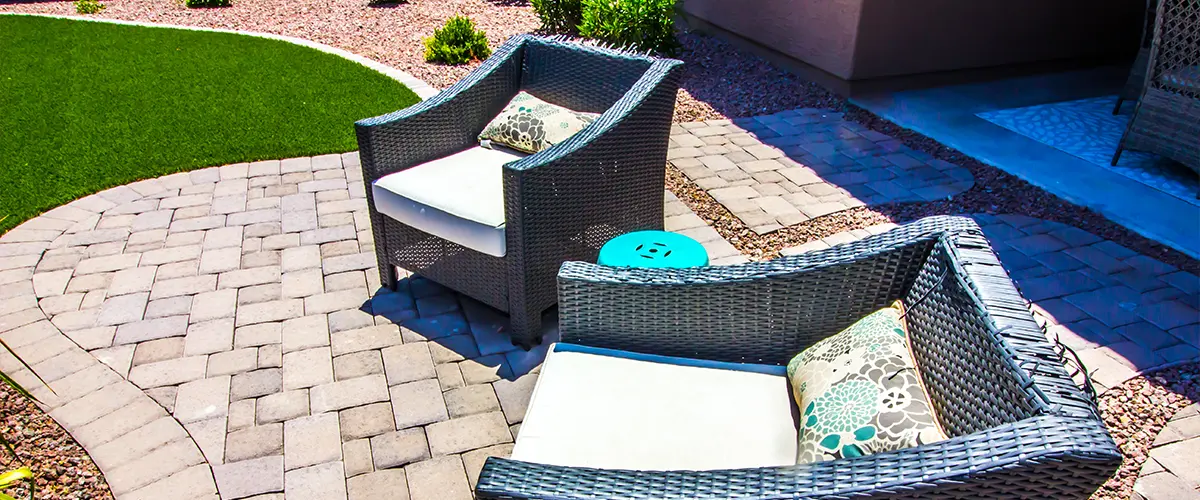 Paver patio with plastic outdoor chairs