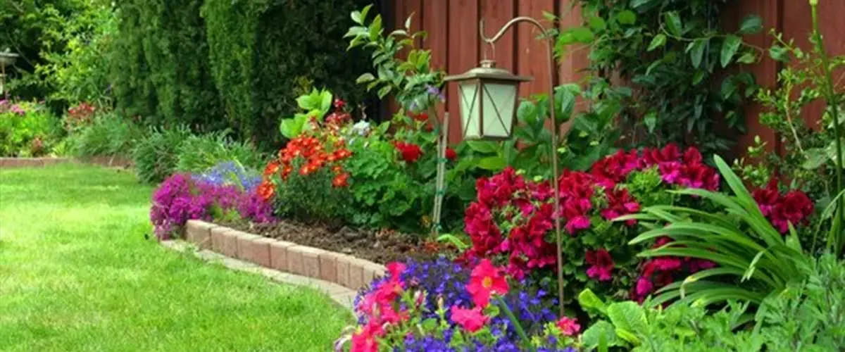 Backyard Flower Bed With Curved Shape Made Of Bricks Landscaping