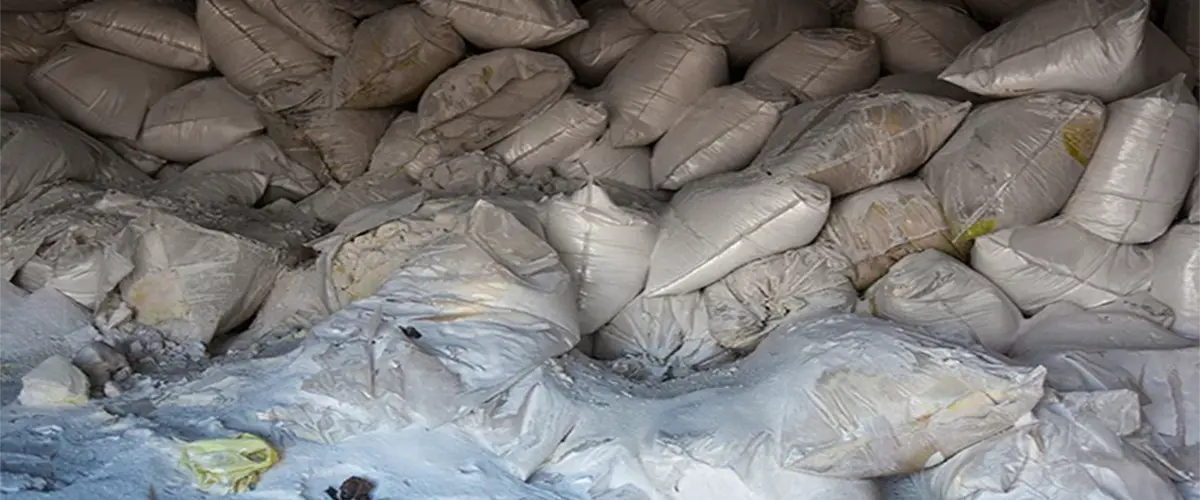 Pile of white sacks filled with synthetic fertilizer