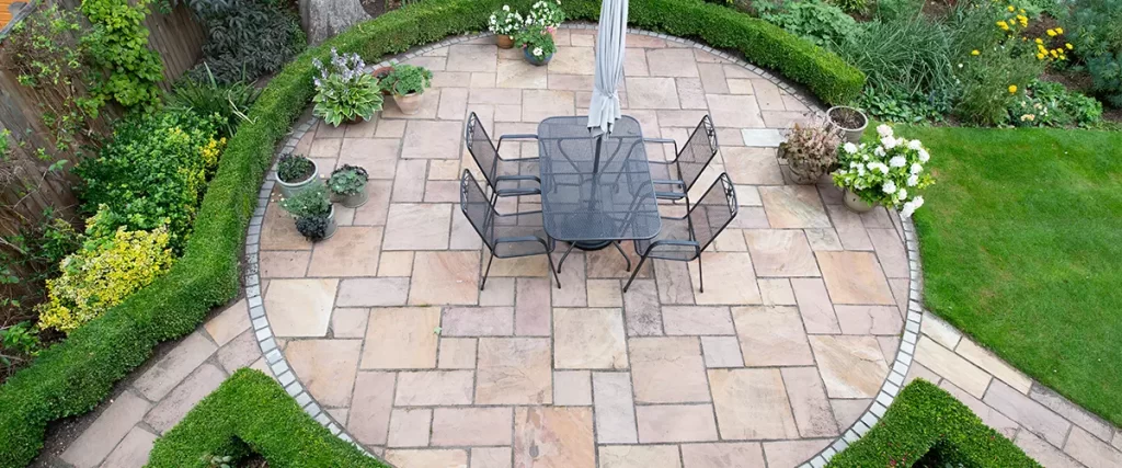 circular garden patio with freshly jet washed paving stones
