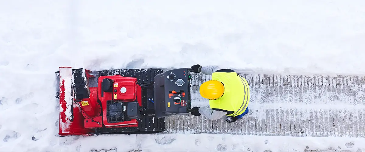 Man Removing Ice Snow With Machine in Bryan OH