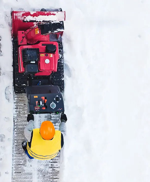 Top View Of Man From Farrell's Removing Snow With Blower In Waterville