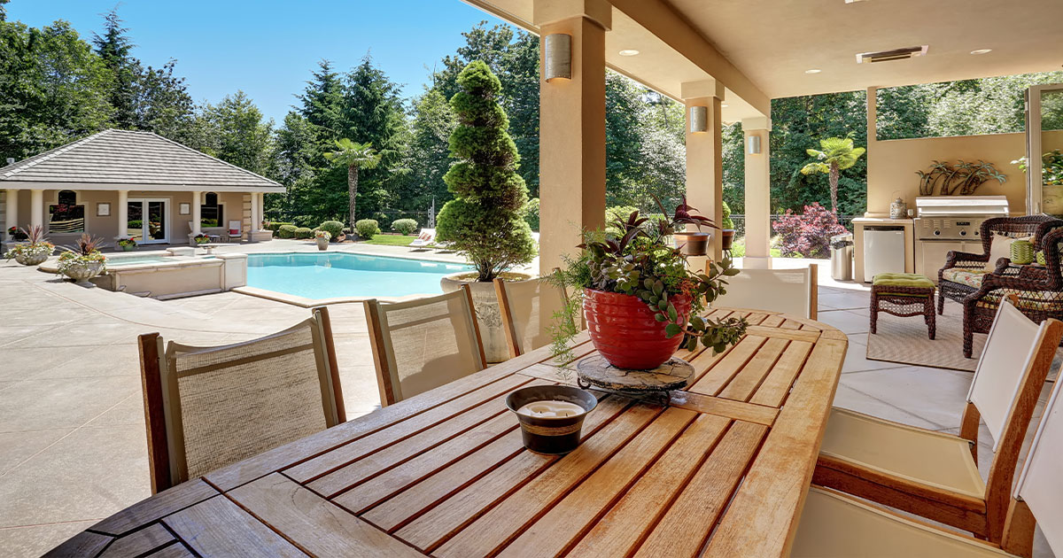 Luxurious-backyard-with-pool,-gazebo,-and-patio-dining-area