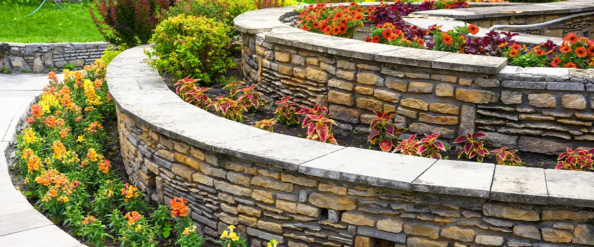 Stone retaining wall in Bryan, Texas, with garden landscaping