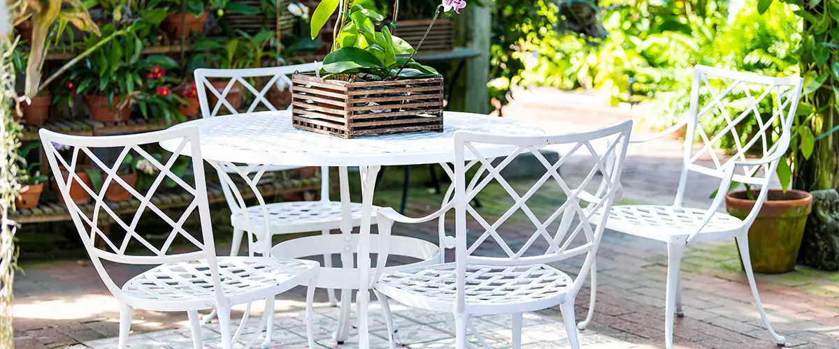 White cast iron chairs, table in outdoor, outside sitting area